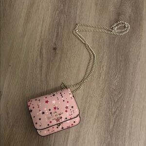 Kate Spade Pink Star-Patterned Card Case on a Purse